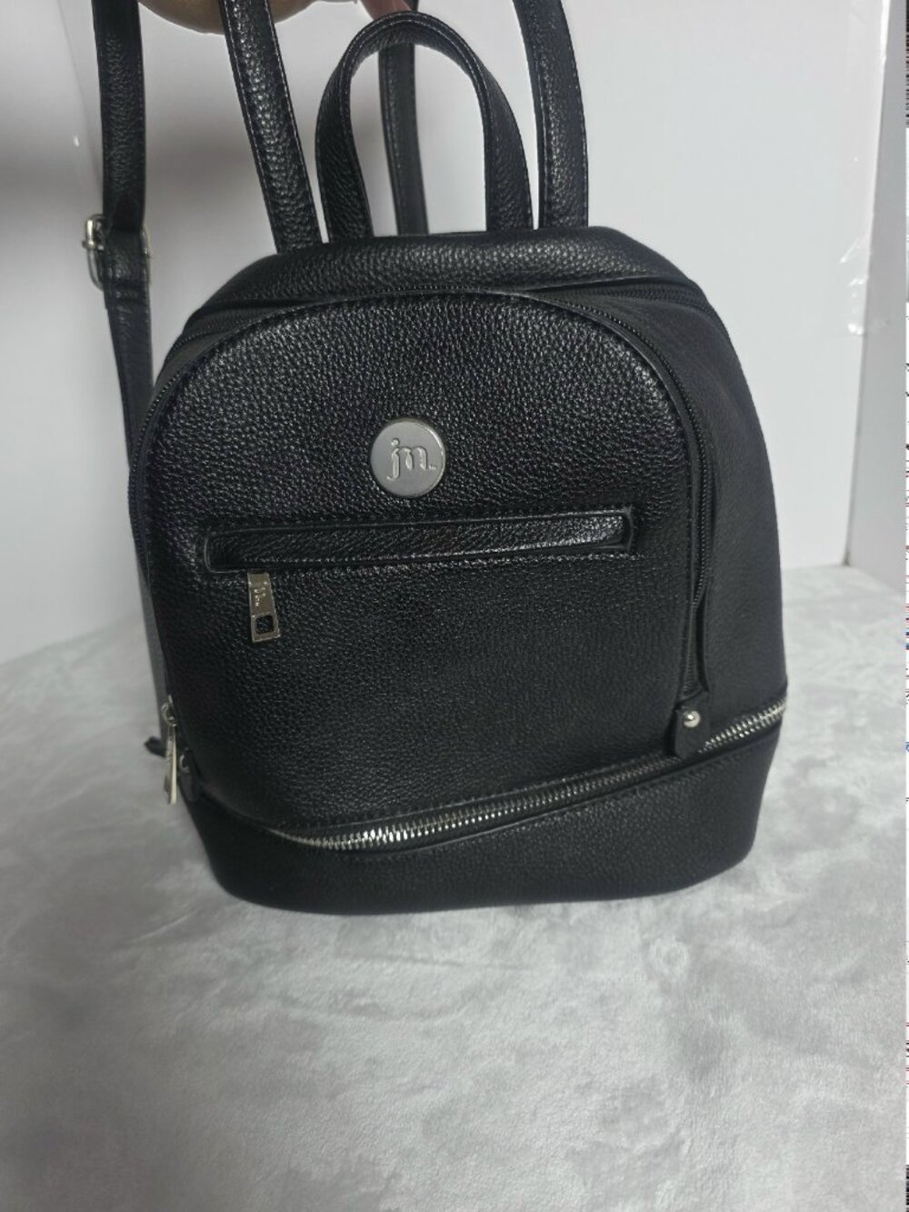 Jessica Moore Essentials Mini Backpack in black faux pebbled leather.